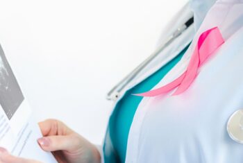 Woman doctor examining scan with pink ribbon 2026 09 24 07 24 37 utc 1